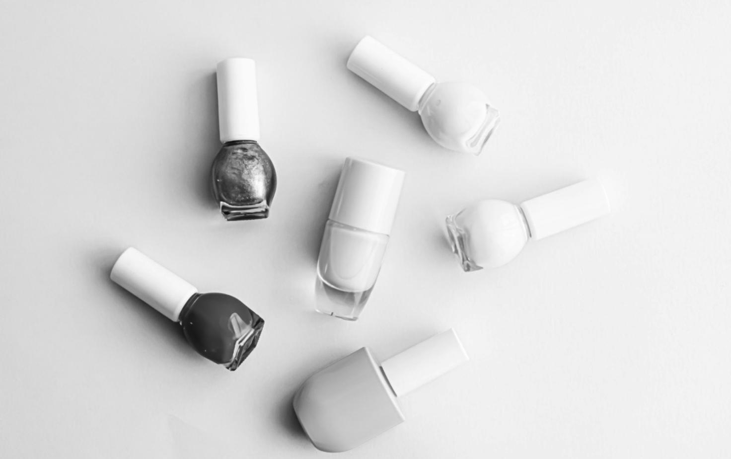 Professional nail art workspace setup with organized tools and practice materials